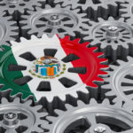 Mexican flag on the gearwheel, business industrial concept. 3D rendering
