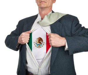 Man revealing shirt with an image of the Mexican flag on the front