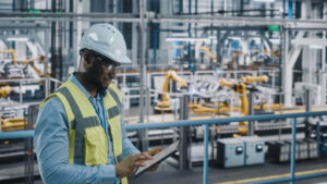 man wearing vest in factory